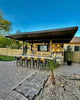 KoKoMo Fantasy Island Outdoor Kitchen Pavilion – 20'x20' Luxury BBQ Island with 70" TV, Bar, Grill, Kegerator & More