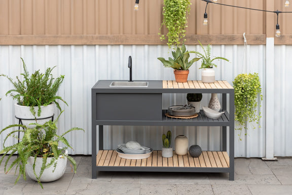 A dark gray outdoor kitchen island