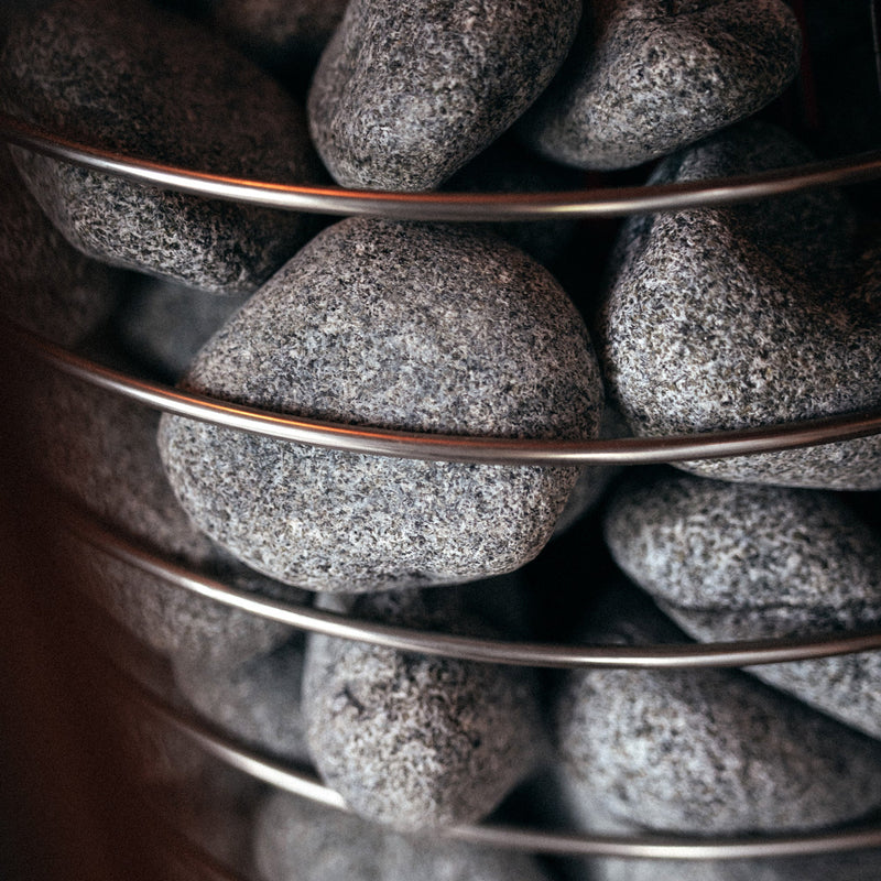 Stack of gray stones in a wire basket