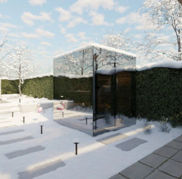 Modern glass building in a snowy landscape with trees and clear sky.