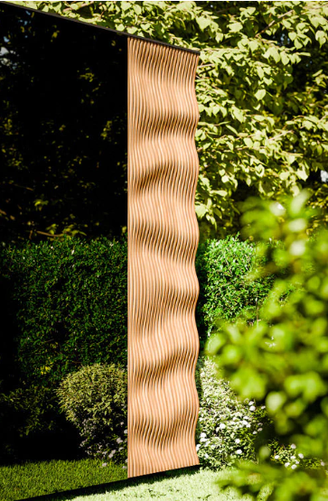 Wavy wooden panel in a garden setting with greenery