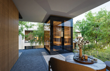 Modern interior with glass wall, wooden furniture, and outdoor greenery