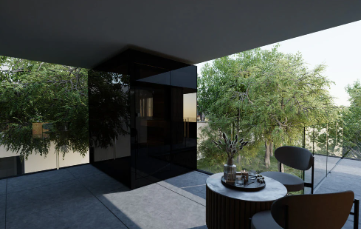 Modern black house with large glass windows and outdoor seating area.